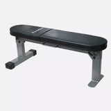 PowerBlock unfolded standing flat weight bench in black and silver, designed for compact home gyms and strength training in small spaces.