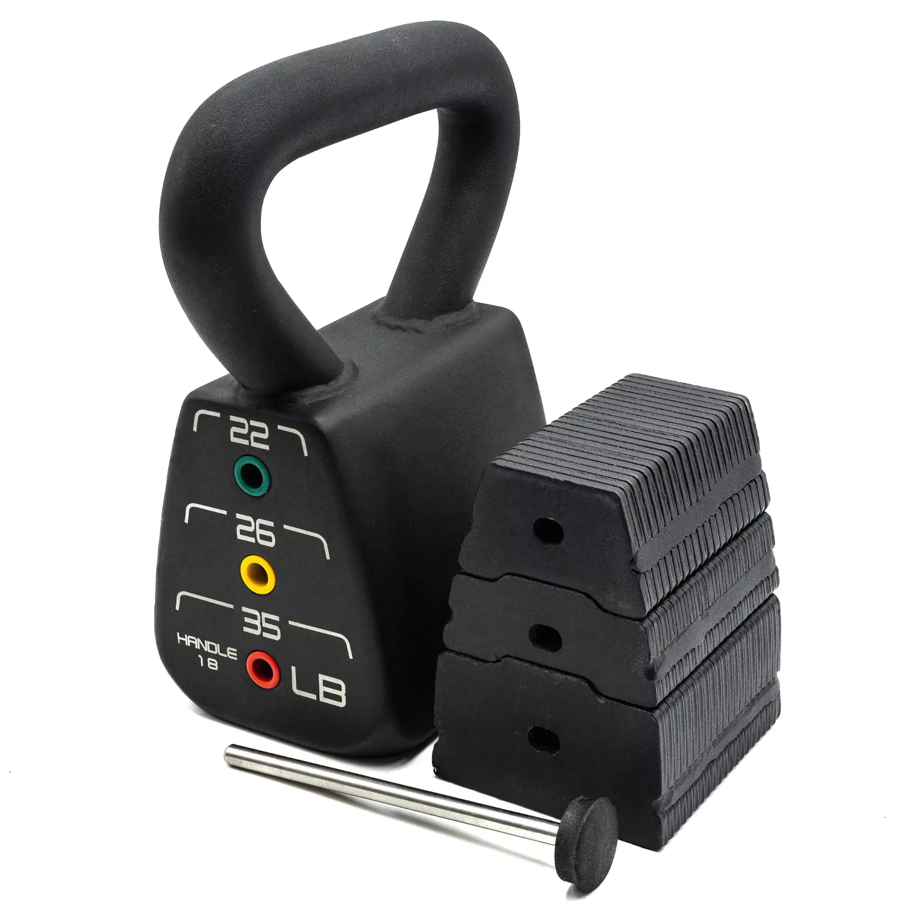 A single Powerblock adjustable kettlebell on the floor next to its weight plates. They display show their different level adjustment 