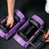 A person displaying the locking/adjusting system on the sport 24 adjustable dumbbell (lavender)